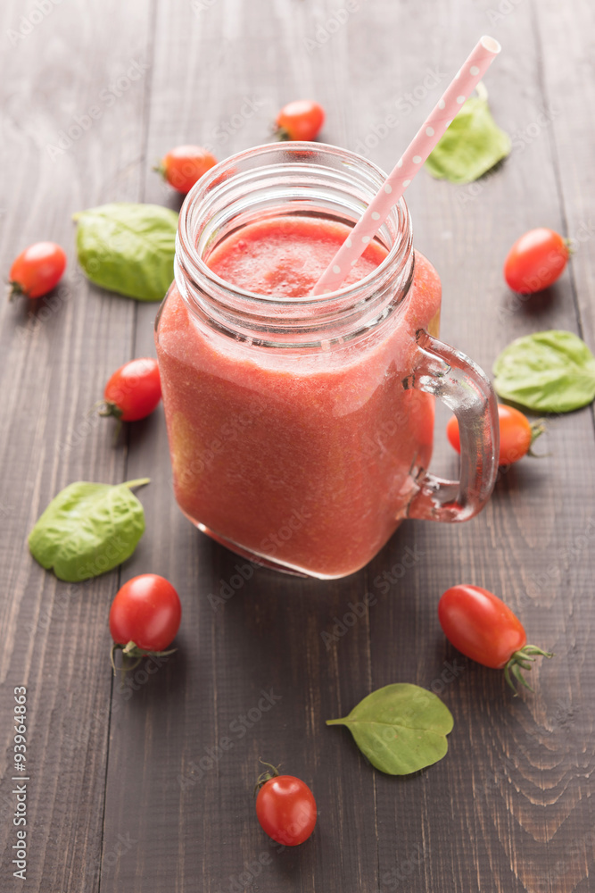 Healthy vegetable. Glass of red tomato juice on wooden table Healthy vegetable. Glass of red tomato juice on wooden table