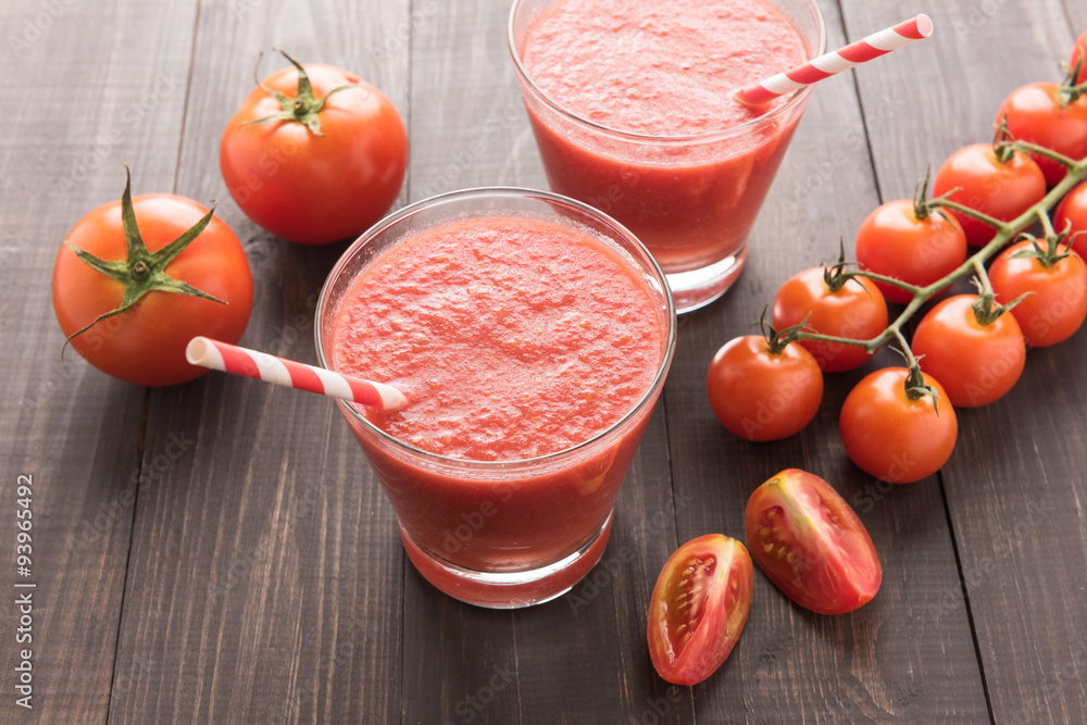 Healthy vegetable. Glass of red tomato juice on wooden table Healthy vegetable. Glass of red tomato juice on wooden table