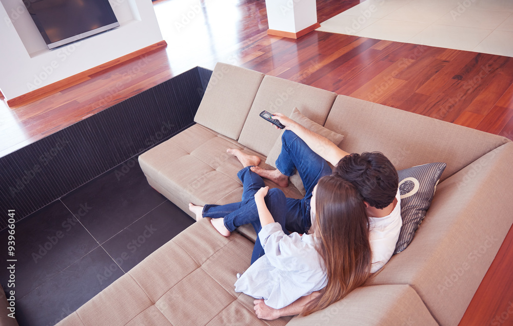 young couple watching tv at home young couple watching tv at home