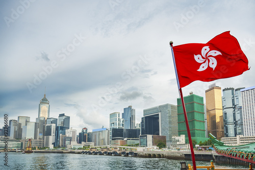 Hong Kong Flag with urban background photo