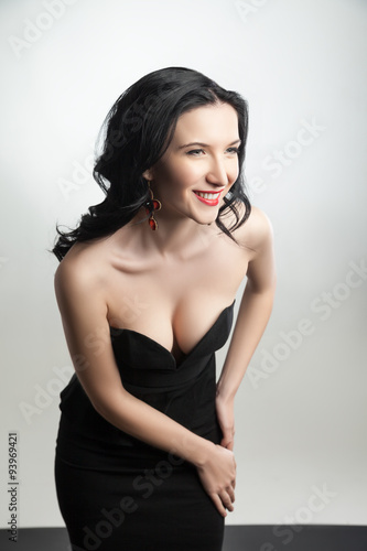 Portrait of a gorgeous smiling lady wearing black corset and