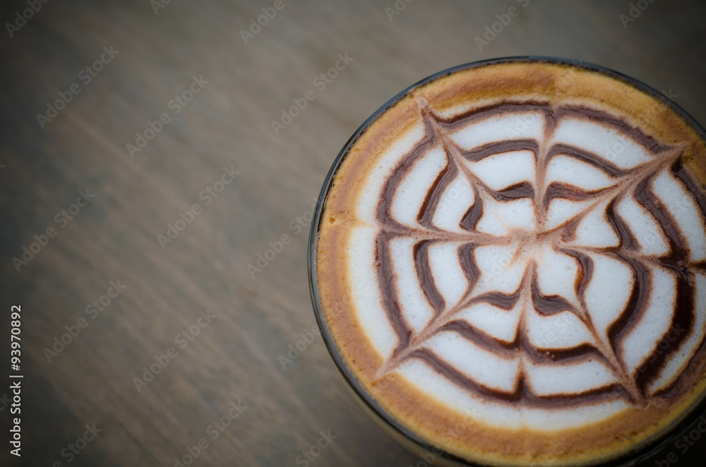 hot latte art coffee on wooden table hot latte art coffee on wooden table