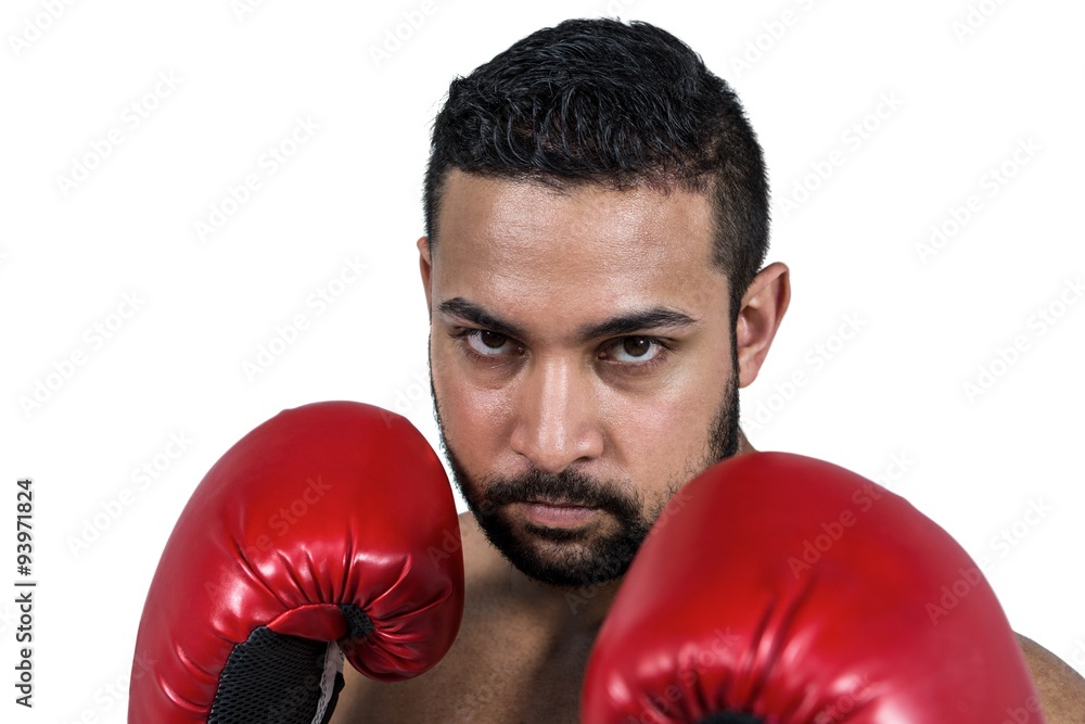 Muscular man boxing in gloves