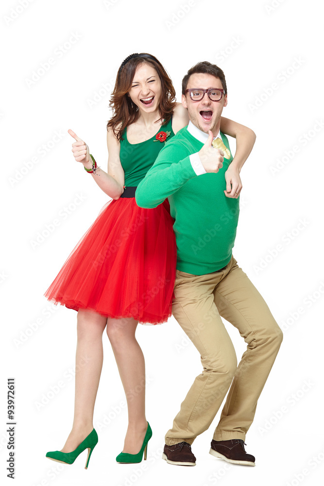 Interracial weird nerd couple showing OK sign. Caucasian young man wearing eyeglasses and smiling asian woman showing thumbs up sign and wearing 50 style clothes. Fifties nerd concept Interracial weird nerd couple showing OK sign. Caucasian young man wearing eyeglasses and smiling asian woman showing thumbs up sign and wearing 50 style clothes. Fifties nerd concept