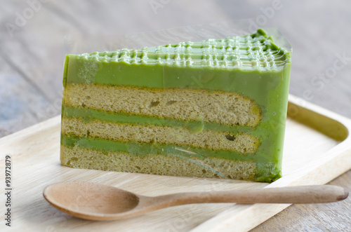 Green tea cake on wooden plate