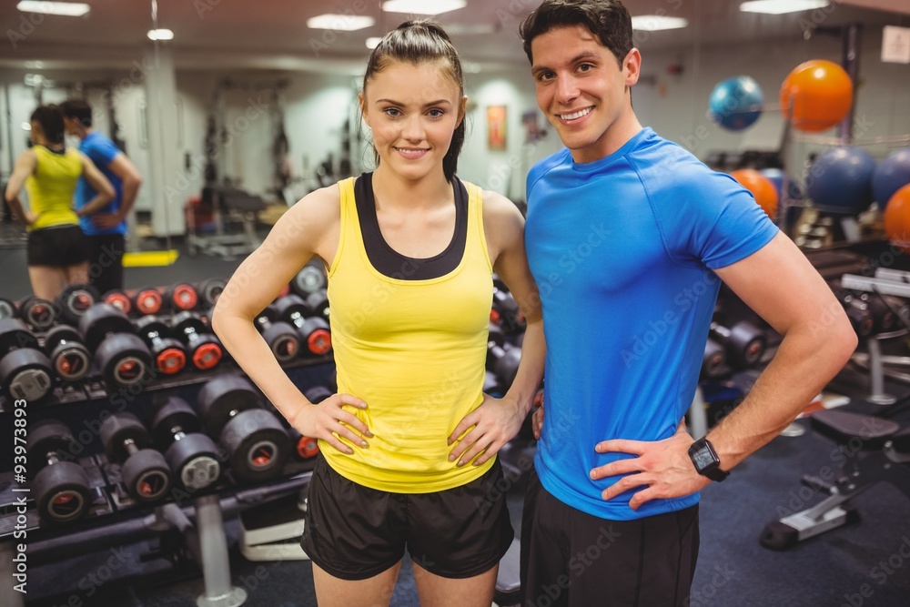 Fit couple smiling at camera Fit couple smiling at camera