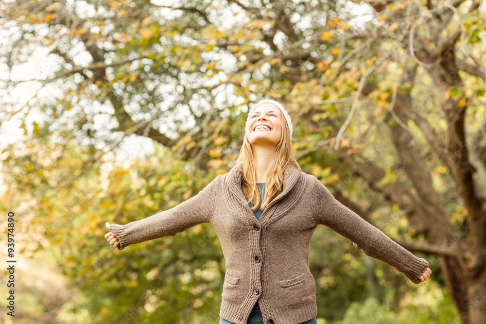 Smiling woman with arms outstretched Smiling woman with arms outstretched
