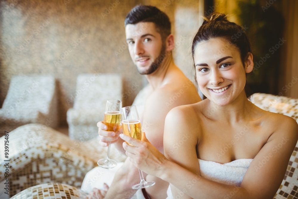 Happy couple celebrating with champagne Happy couple celebrating with champagne