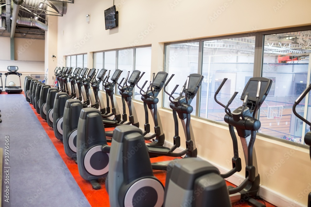Fototapeta premium Collection of exercise bikes in a row