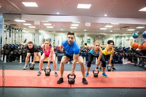 Fit people working out in fitness class