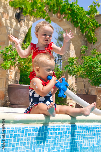 Happy children playing in the pool photo