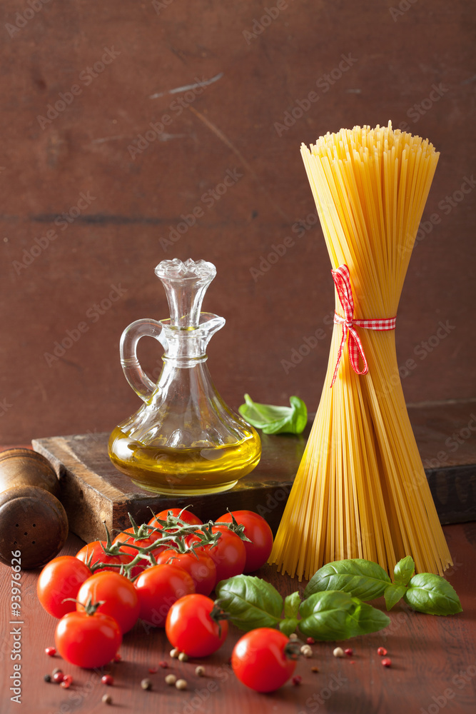 raw pasta olive oil tomatoes. italian cuisine in rustic kitchen raw pasta olive oil tomatoes. italian cuisine in rustic kitchen