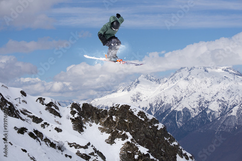 Flying skier on mountains, extreme sport