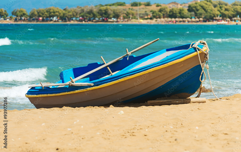 Wooden boat on the beach. Space for your text.