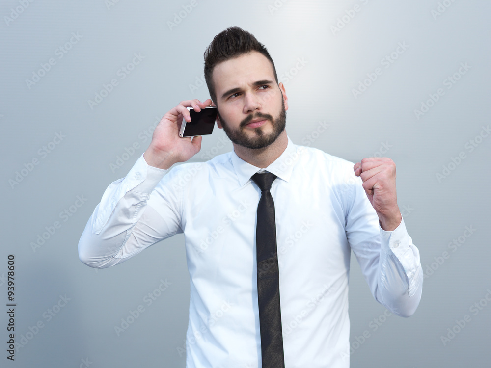 Angry businessman at the cell phone Angry businessman at the cell phone