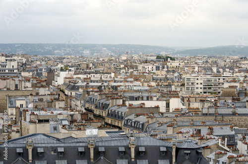 Roofs of Paris with moody sky