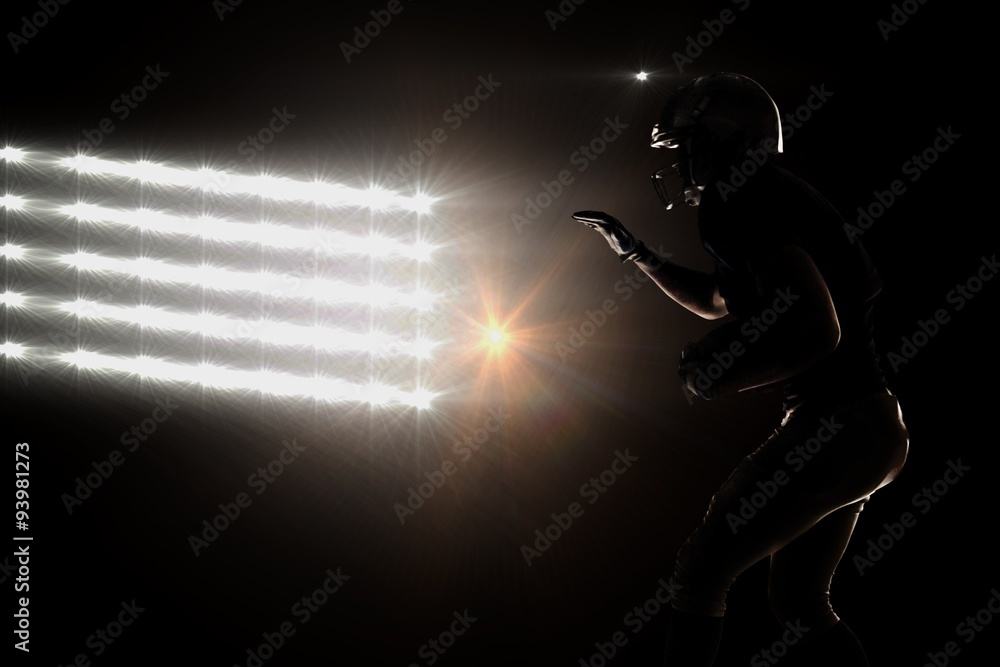 Fototapeta premium Silhouette of sportsman playing american football