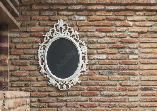 The mirror on the old brick wall
