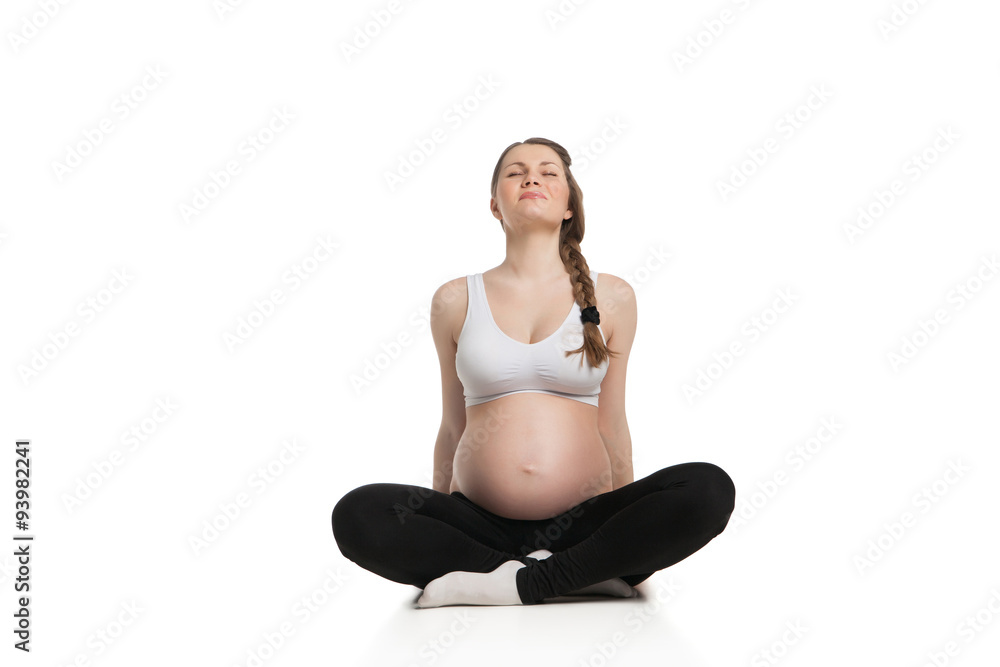 sports pregnant woman doing stretching exercise sports pregnant woman doing stretching exercise