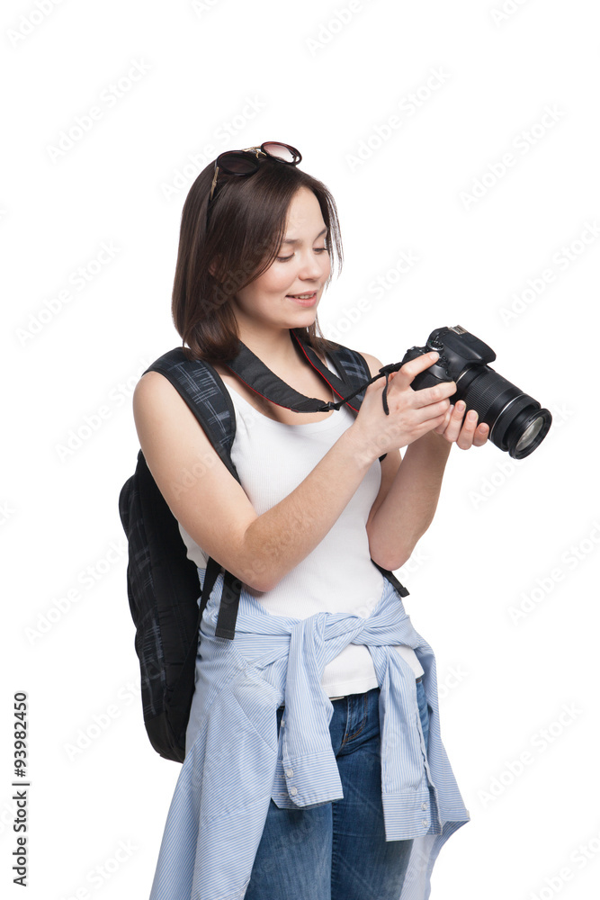 Young female tourist with backpack looking to her camera Young female tourist with backpack looking to her camera