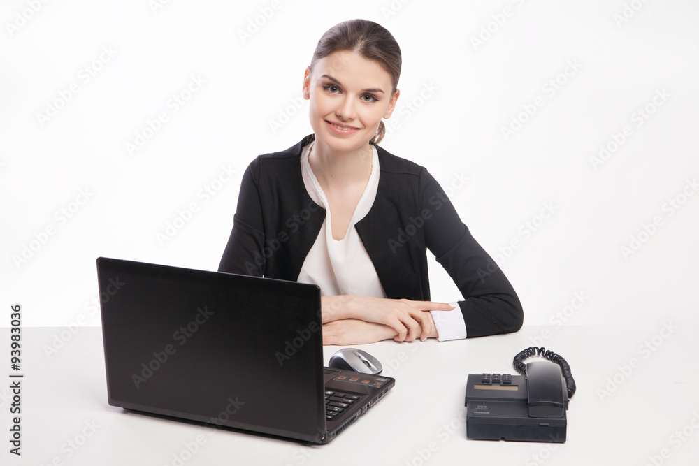 Young woman with laptop talking on the phone Young woman with laptop talking on the phone