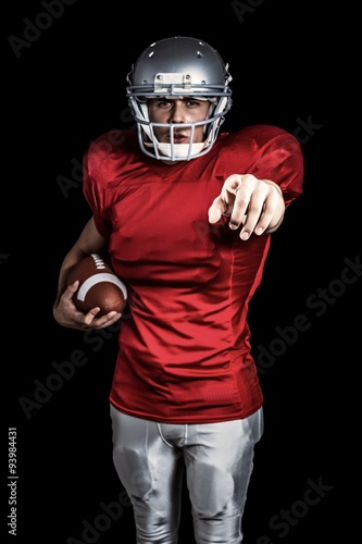 American football player pointing the camera