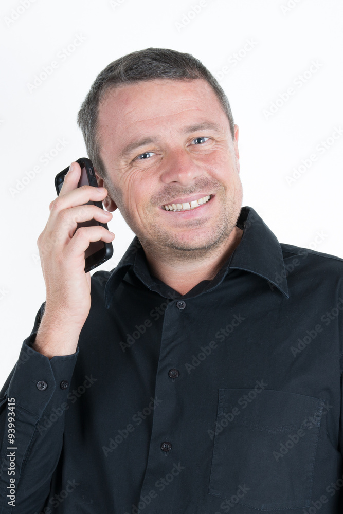 Happy smiling young man talking on mobile isolated on white background Happy smiling young man talking on mobile isolated on white background