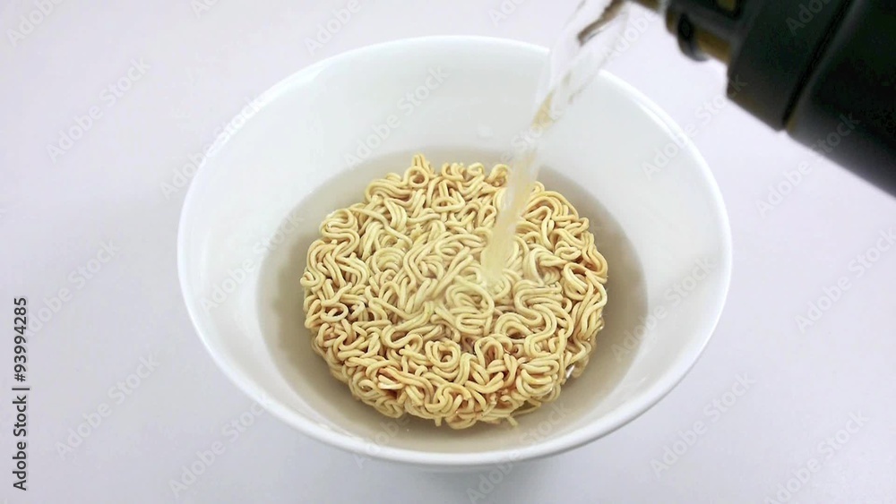 Pour boiling water into the Instant noodle bowl. Pour boiling water into the Instant noodle bowl.