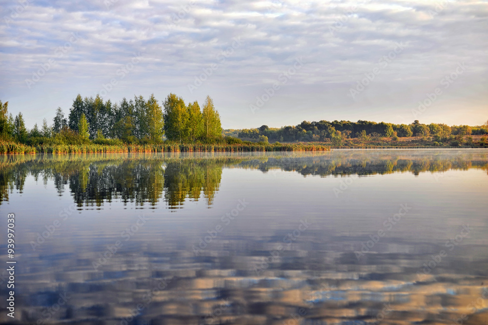 Fototapeta premium Water landscape with clouds reflection