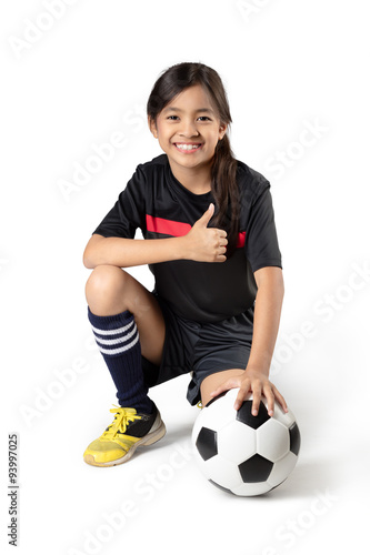 Young asian girl holding soccer ball, Isolated over white