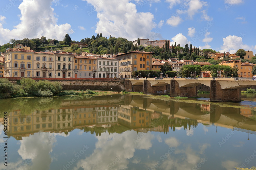 Old buildings and bridge Ponte alle Grazie over Arno River