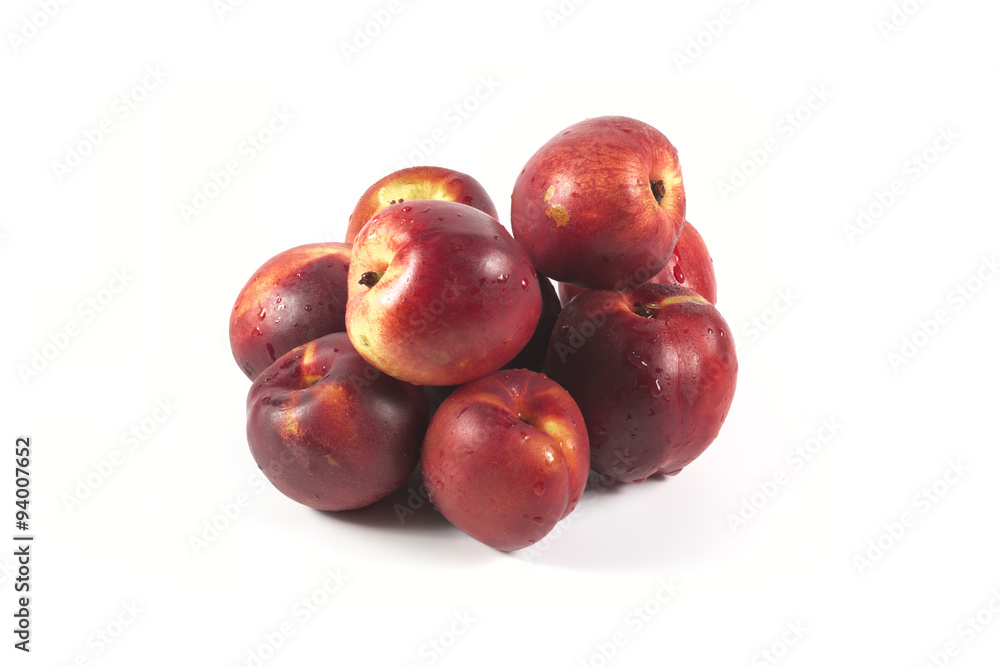 Fresh ripe red peaches with water drops isolated on white
