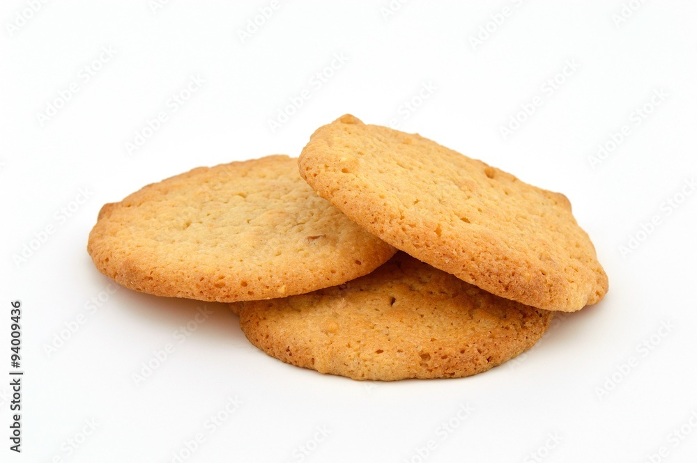 Three homemade peanut butter cookies on a white background. Three homemade peanut butter cookies on a white background.