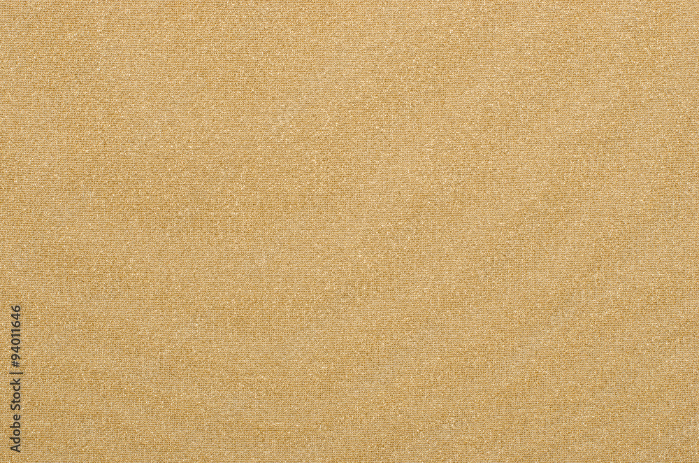 Yellow gold textile pattern as a background. Close up on sparkly gold material texture fabric. Yellow gold textile pattern as a background. Close up on sparkly gold material texture fabric.