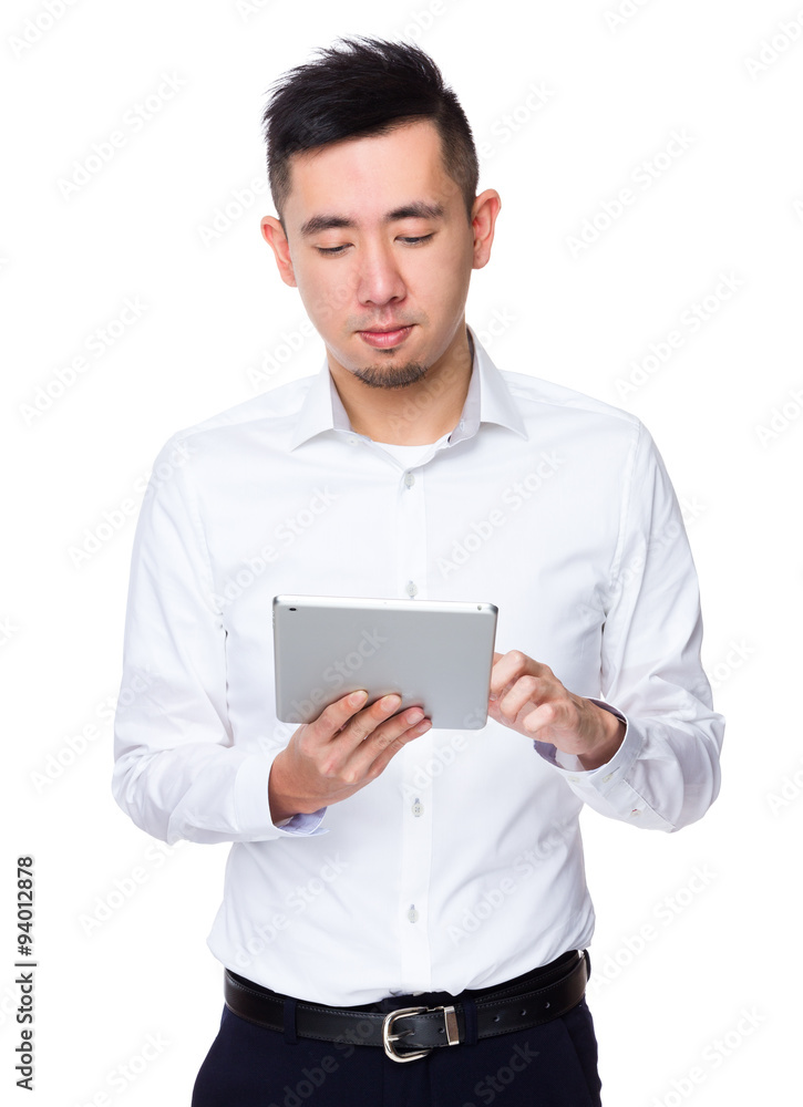 Asian Businessman use of the tablet pc Asian Businessman use of the tablet pc