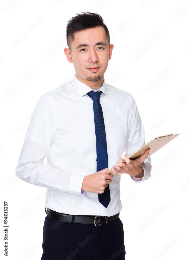 Asian Young businessman hold with clipboard Asian Young businessman hold with clipboard