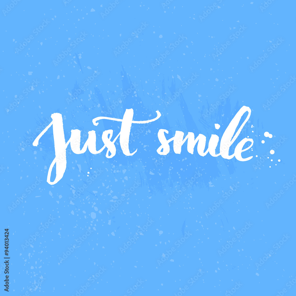 Just smile - inspirational quote handwritten on blue background
