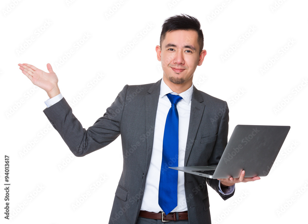 Asian Young Businessman hold with laptop computer and open hand Asian Young Businessman hold with laptop computer and open hand