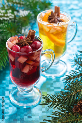 Christmas mulled wine and apple cider on a blue background