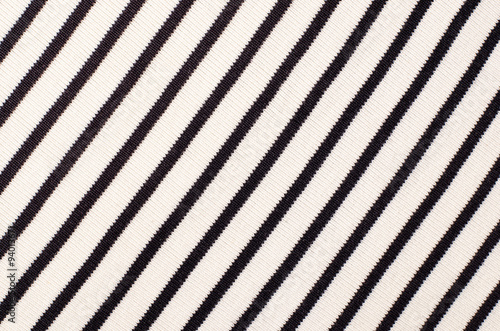 Striped blue and white textile pattern as a background. Close up on diagonal stripes material texture fabric.