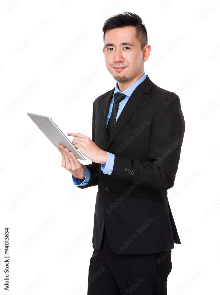 Asian Young Businessman use of the tablet pc Asian Young Businessman use of the tablet pc