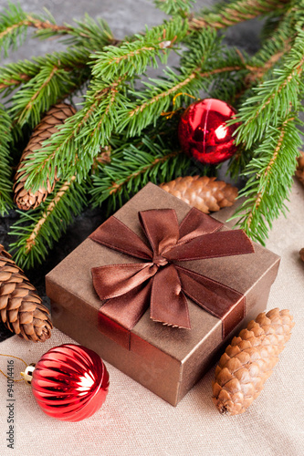 brown gift box, Christmas ball and Green fir branches © katrinkivi