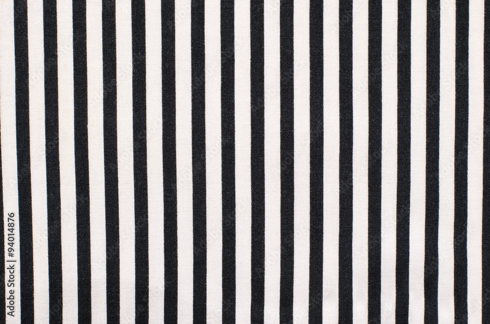 Fototapeta premium Navy blue and white striped background. Vertical stripes pattern on fabric.