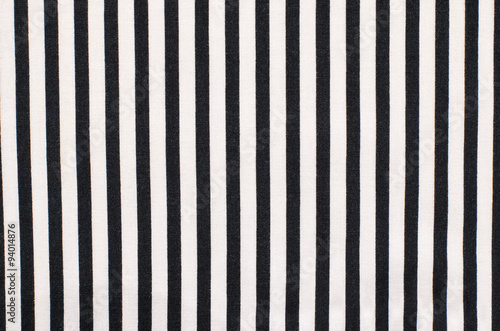 Navy blue and white striped background. Vertical stripes pattern on fabric. photo