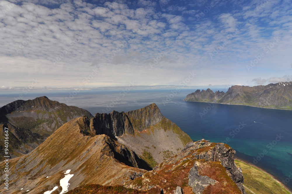 Obraz premium Norwegian nature / There are mountains plunging into the sea from hundreds of metres, fjords, tall mountain peaks, northern lights and midnight sun.