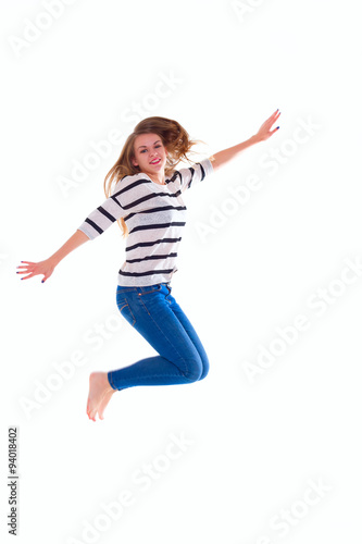 smiling girl in white blank t-shirt jumping
