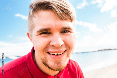 Smiling man at the beach