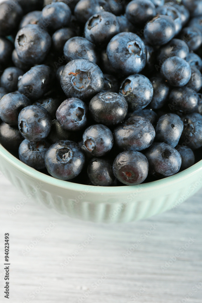 Fresh blueberries in bowl on table close up Fresh blueberries in bowl on table close up