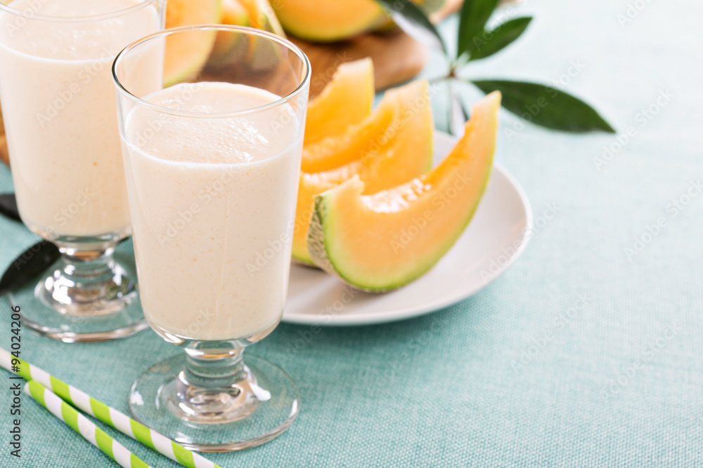 Healthy cantaloupe smoothie in a tall glass Healthy cantaloupe smoothie in a tall glass
