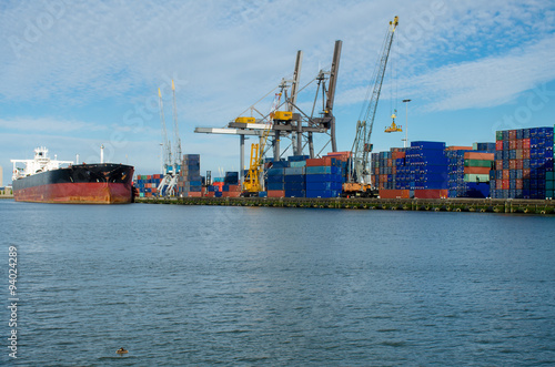Loading/unloading shipping containers in the port of Rotterdam, Netherlands.